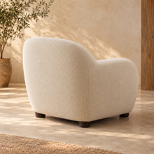 Cream rounded lounge chair — view 2